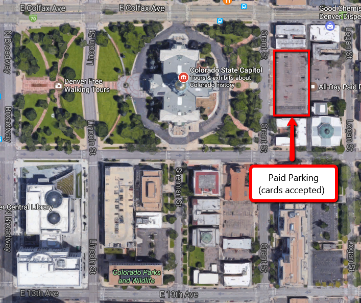 An aerial view of the Colorado State Capitol building and surrounding streets. The lot just east of the capitol building is boxed in red, and there is a white text box below it that says, "Paid Parking (cards accepted)" with a red arrow pointing to the lot.