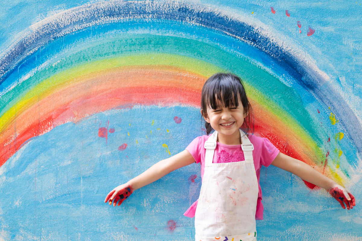 Kindergarten girl, painted rainbow