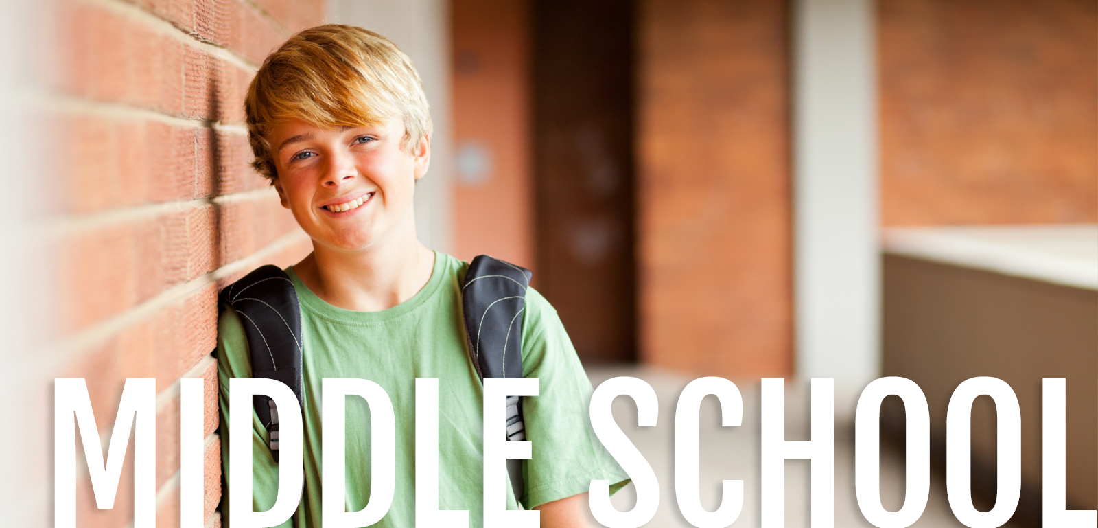 Middle School Boy with backpack, smiling