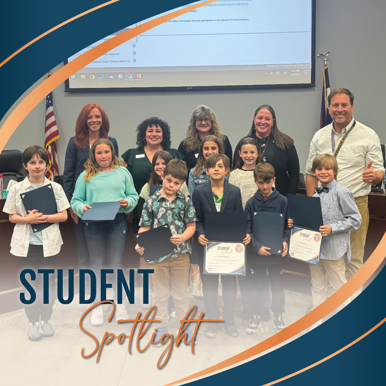 Runyon Elementary School students in a group photo with Board of Education members in front of the Board's dais. Students are holding certificates.