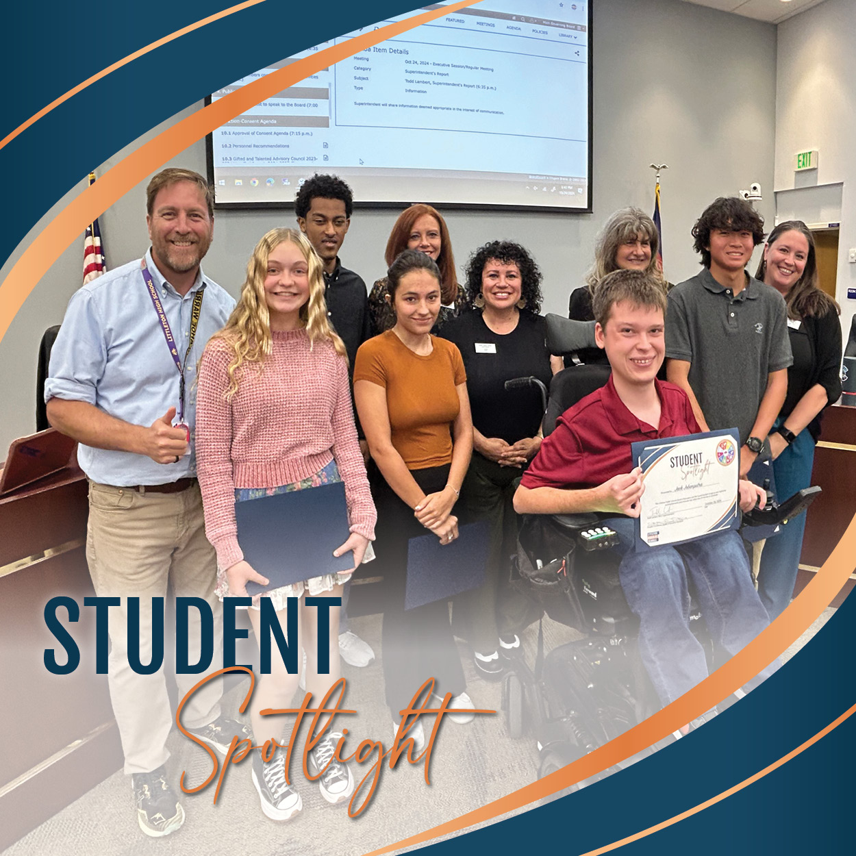 A group of high school students proudly hold their "Student Spotlight" certificates while standing with members of the Board of Education at a recent board meeting, all smiling for the camera. Four board members stand behind the honored students. The photo is framed with a stylish blue and orange swoosh design that includes the words "Student Spotlight," adding a celebratory feel to the recognition moment.