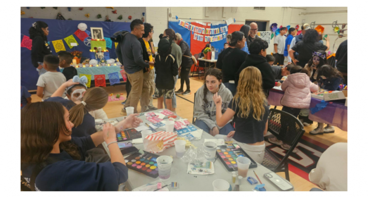 interaction between LPS students and community members at the 1st Dia de los Muertos event